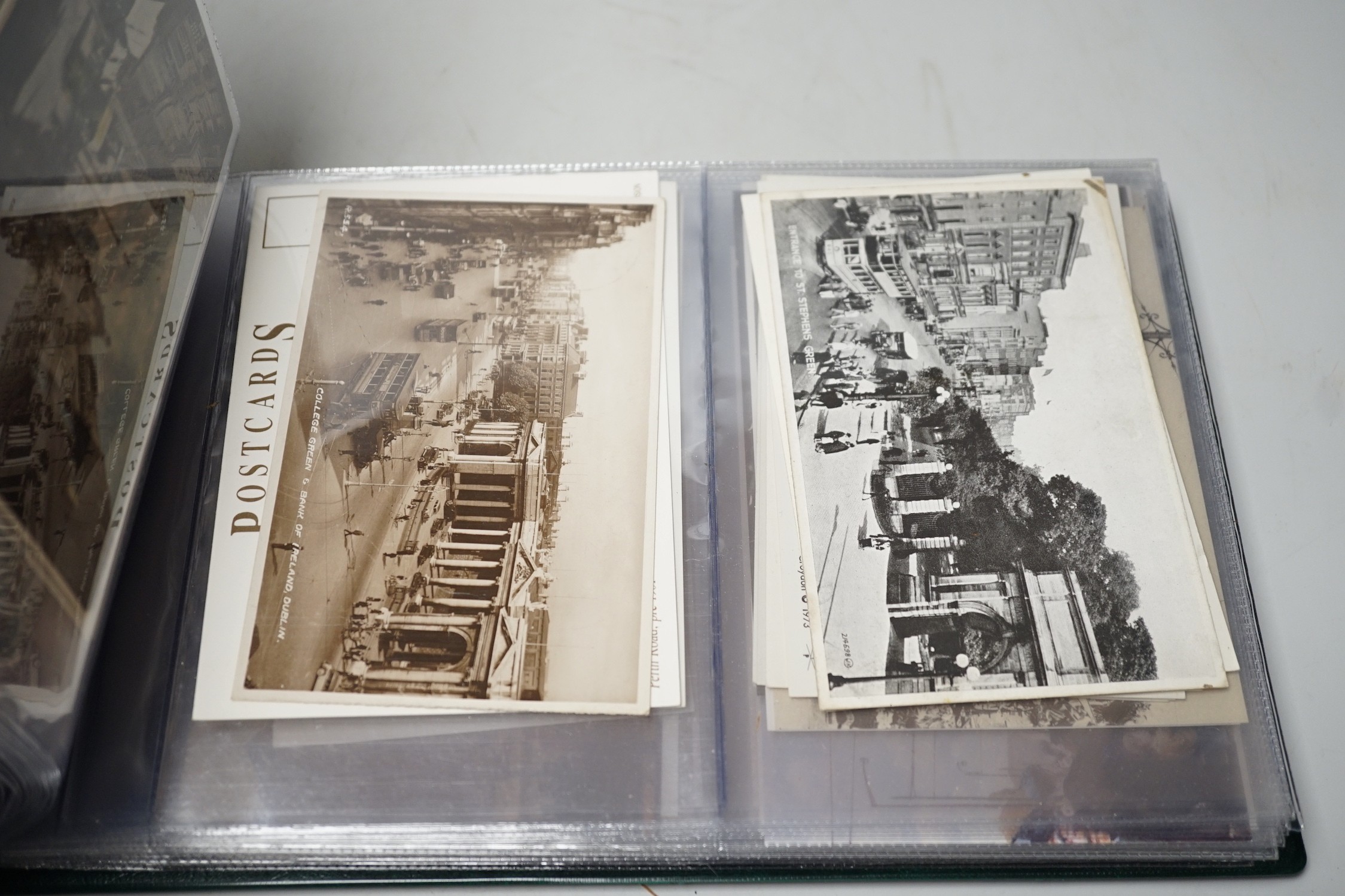 Postcards in three albums, to include themes, transport, theatre and topographical